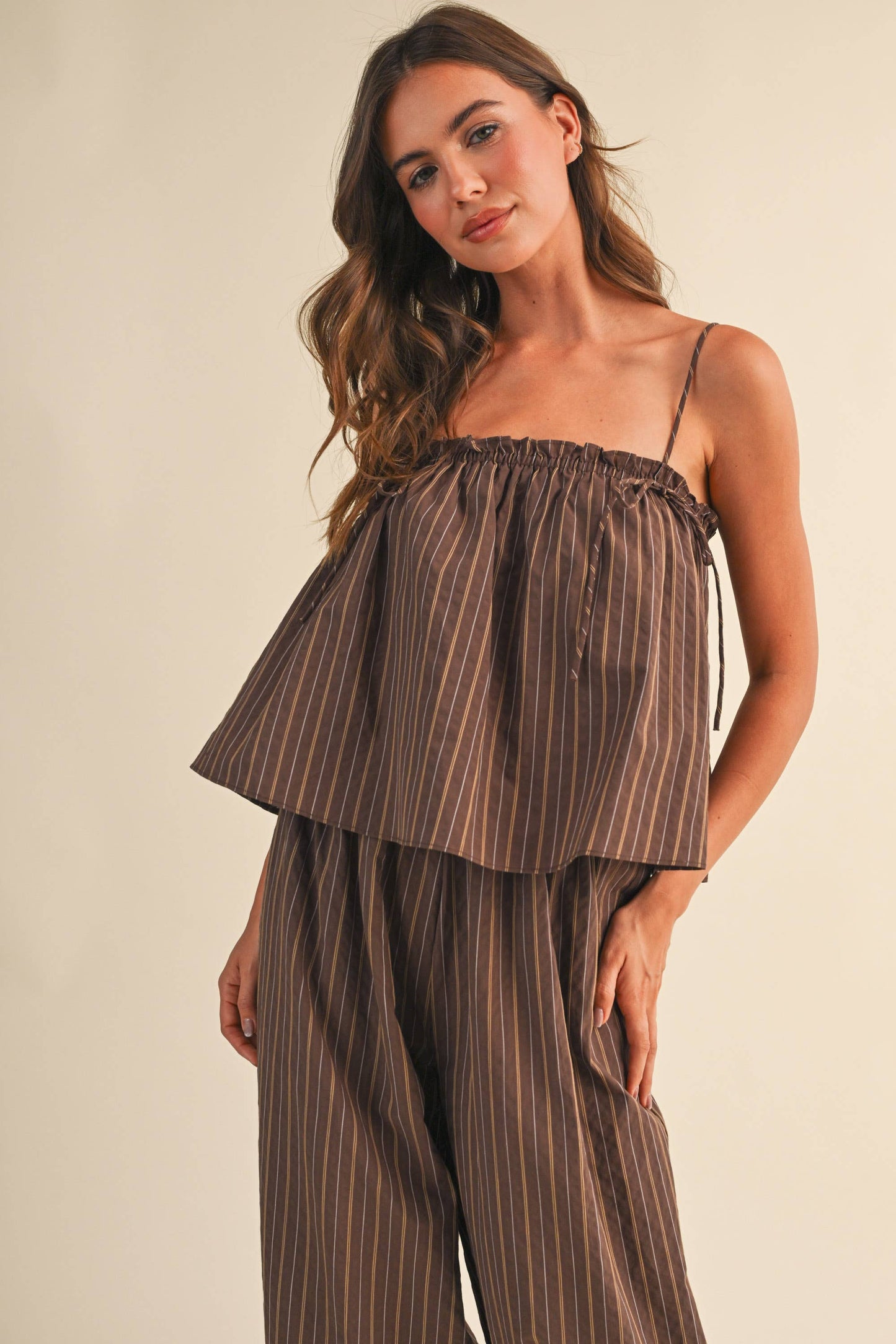 STRIPED SLEEVELESS FLOWY JUMPSUIT