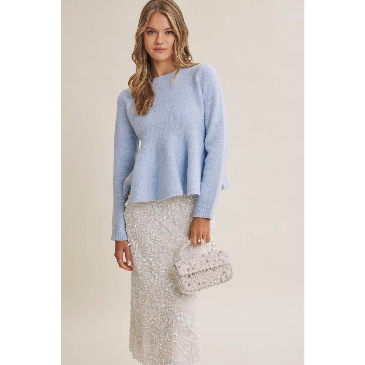PEPLUM WOOL SWEATER