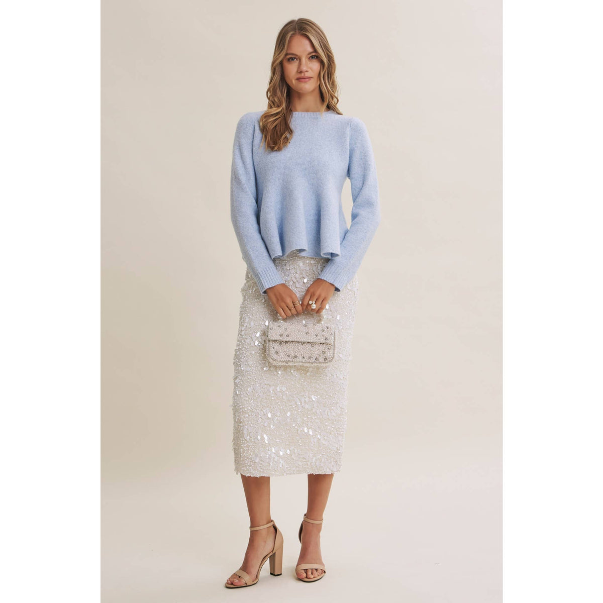 PEPLUM WOOL SWEATER