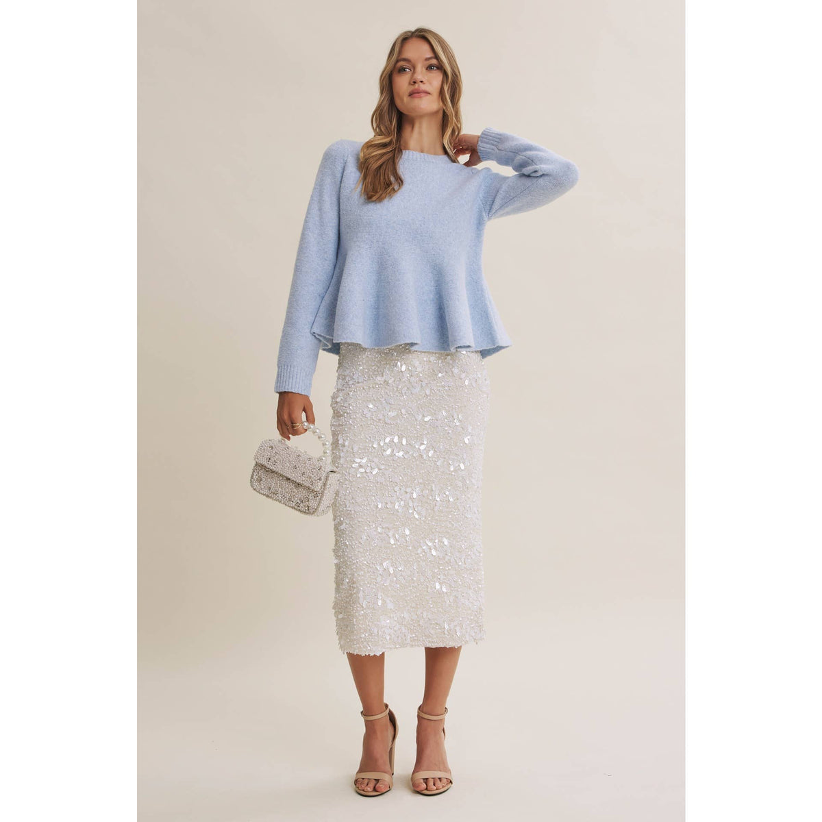 PEPLUM WOOL SWEATER