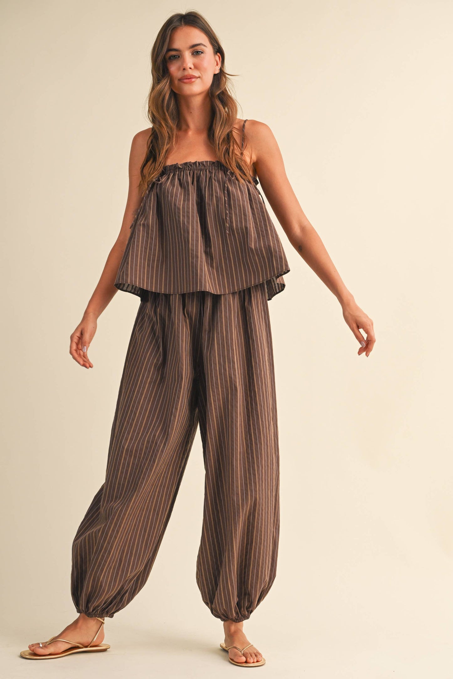 STRIPED SLEEVELESS FLOWY JUMPSUIT