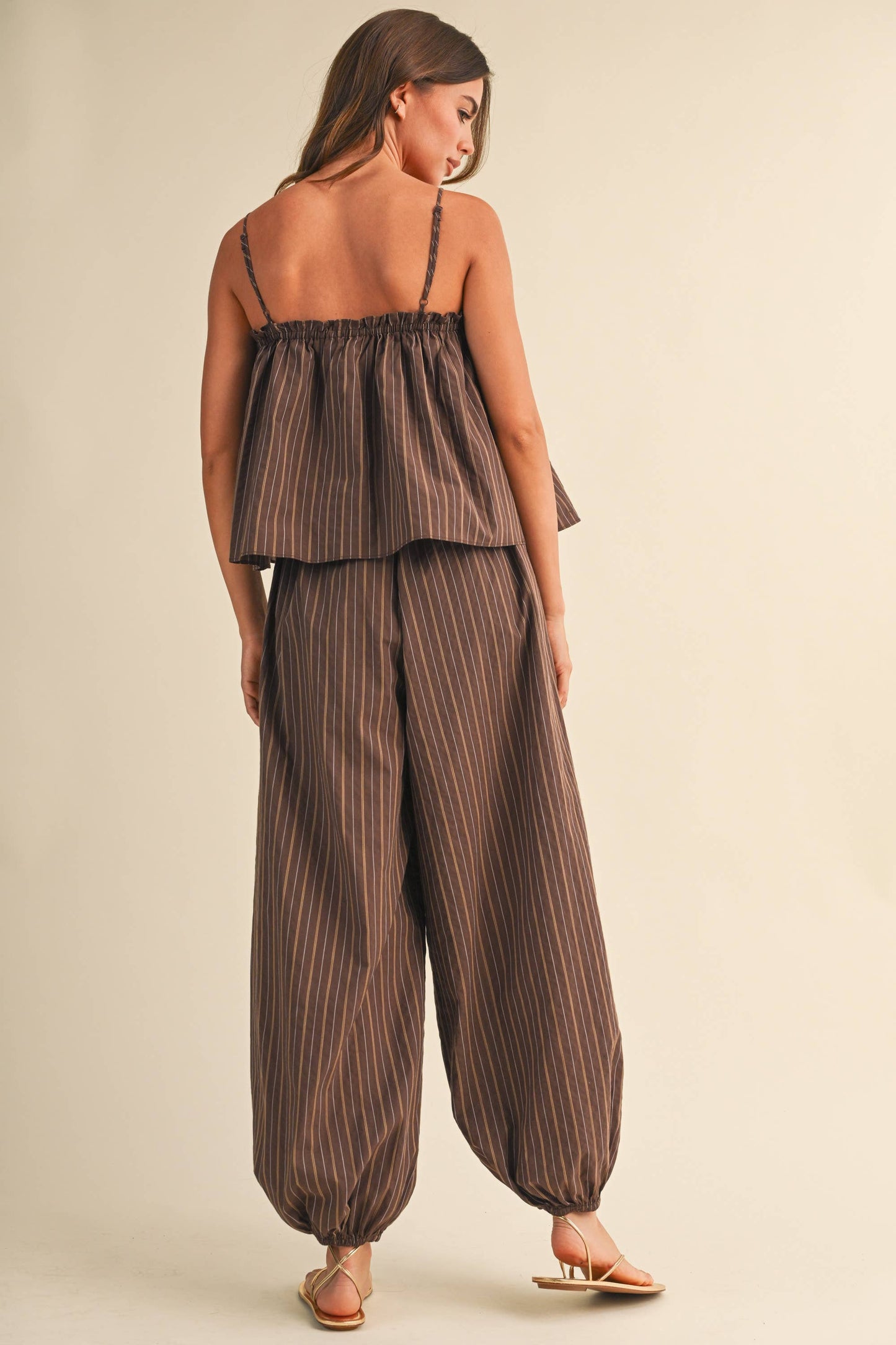 STRIPED SLEEVELESS FLOWY JUMPSUIT