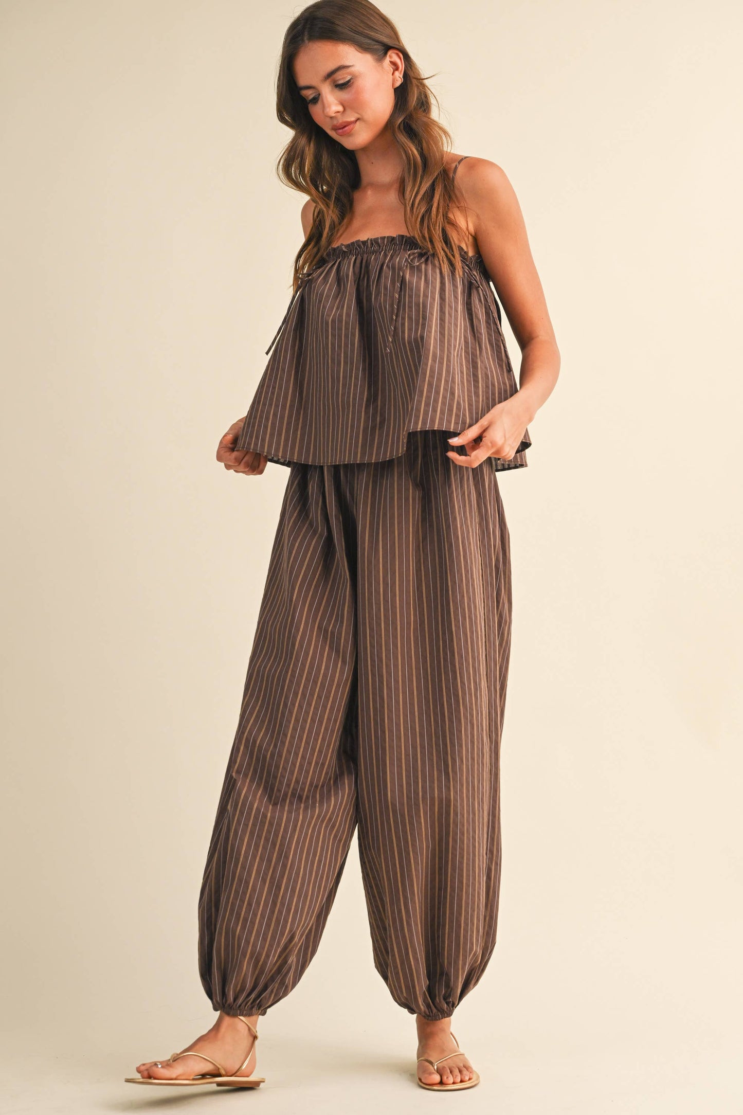 STRIPED SLEEVELESS FLOWY JUMPSUIT
